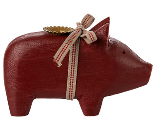 Small red wooden pig candle holder