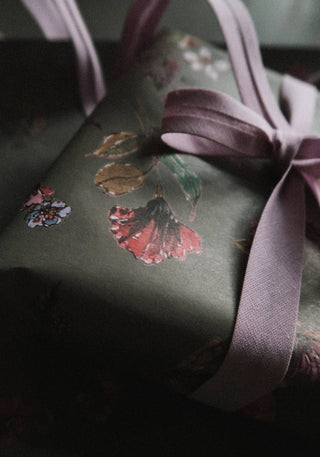 Flowers on dark grey gift wrapping paper