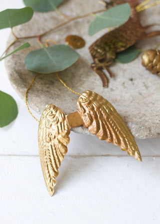 Small brass angel wings ornament