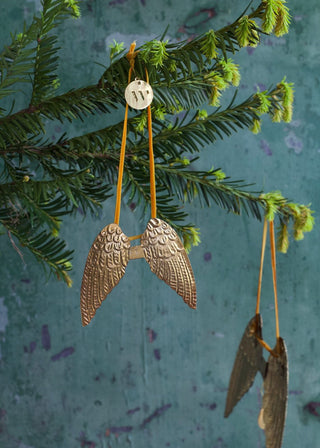 Small brass angel wings ornament