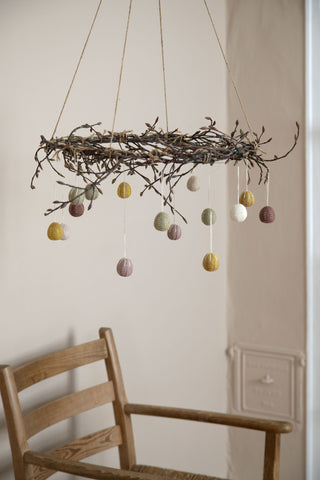 Felt eggs with with embroidered garland ornaments in clay colors - set of 3