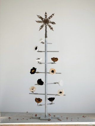 Decorative metal tree with various shaped flower ornaments 