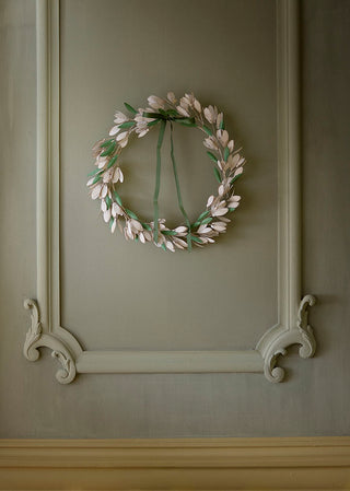 Decorative wreath on a paneled wall
