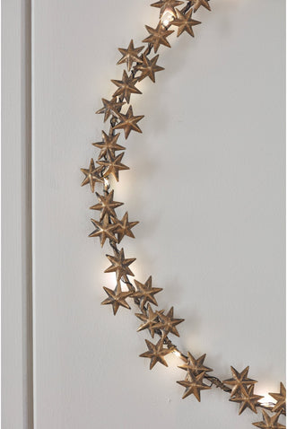 Brass stars lighted wreath