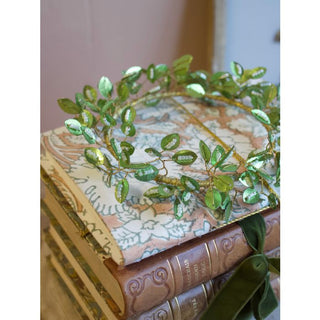 Green leaves wreath with beads