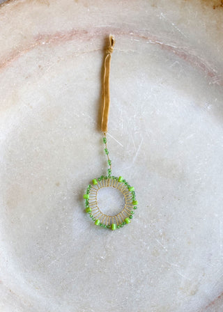 Green glass wreath ornament