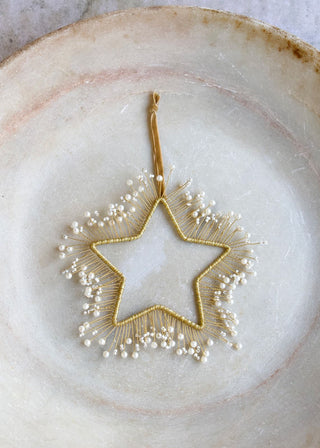 Brass star of pearls ornament