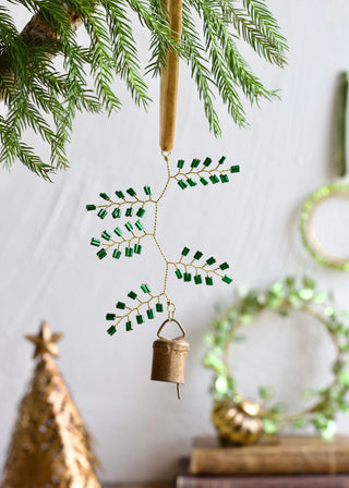 Brass bell with green beads ornament