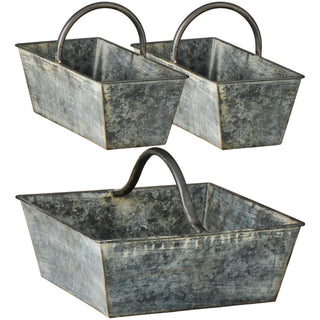 Set of three grey weathered metal baskets with handles, one large square basket and two matching smaller rectangular baskets, shown on a white background