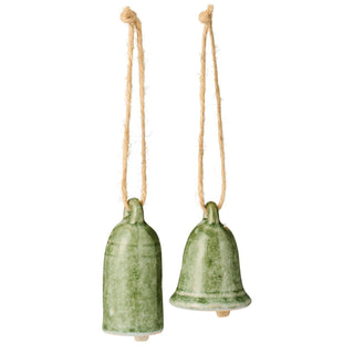 Two small glazed ceramic bell ornaments in mottled green, hanging from jute cord loops on a white background