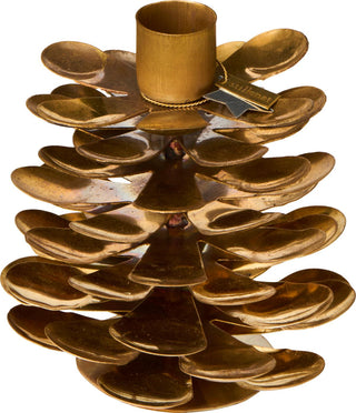 Close-up of a gold brass pinecone candle holder with a 'stillenat' tag attached by a cord