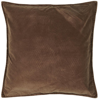 Folded chocolate brown velvet cushion cover with a piped edge on a white background